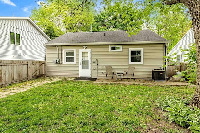 106 Leon St, Madison, WI 53714 - rear view of property featuring central AC, a patio area, and roof with shingles