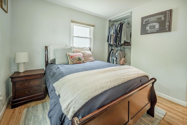 106 Leon St, Madison, WI 53714 - bedroom featuring a closet, light wood finished floors, baseboards, and a walk in closet