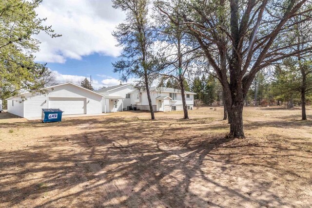 N10368 Queens Way Way, Necedah, WI 54646 - view of property exterior with an attached garage