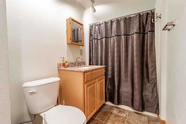 N10368 Queens Way Way, Necedah, WI 54646 - bathroom with curtained shower, vanity, toilet, and track lighting