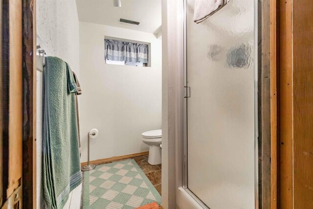 N10368 Queens Way Way, Necedah, WI 54646 - full bathroom featuring toilet, visible vents, baseboards, and a stall shower