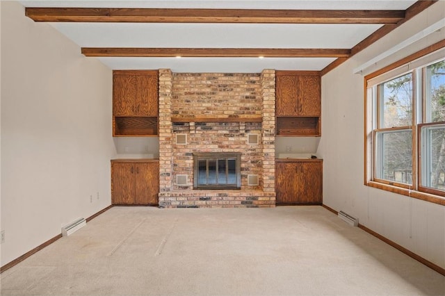 unfurnished living room with a fireplace, carpet floors, baseboards, and beamed ceiling