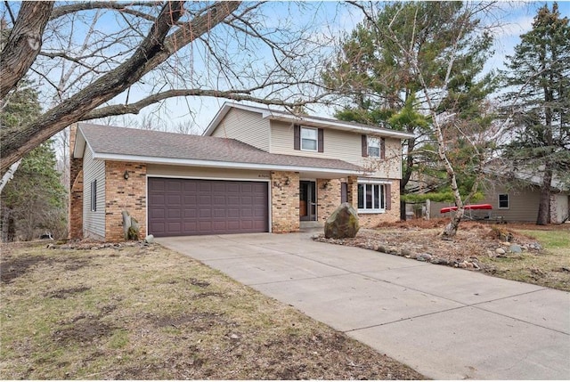 traditional-style home featuring an attached garage, brick siding, driveway, and a shingled roof