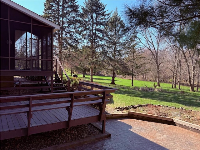 view of yard with a sunroom, a patio, and a deck