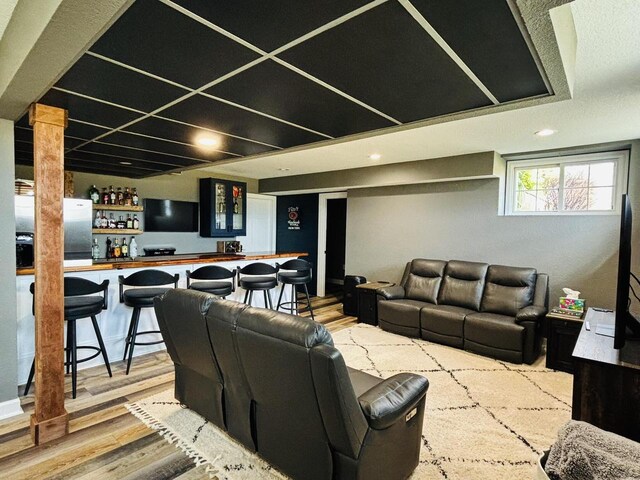 W330S8380 Isabelle Dr, Mukwonago, WI 53149 - living area featuring bar area and wood finished floors