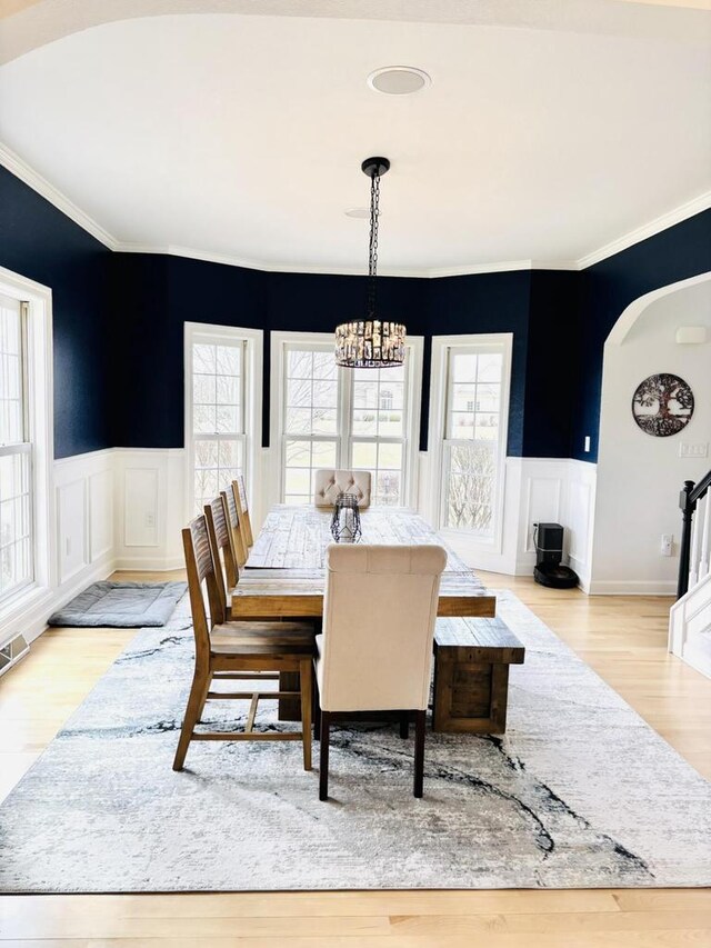 W330S8380 Isabelle Dr, Mukwonago, WI 53149 - dining room featuring a wealth of natural light, light wood finished floors, and a notable chandelier