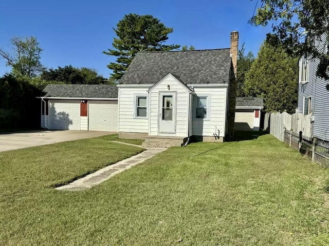 cape cod-style house featuring a garage, fence, a front lawn, a chimney, and concrete driveway