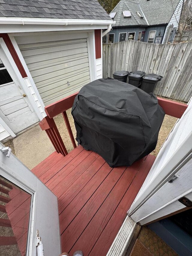 deck featuring a grill and fence