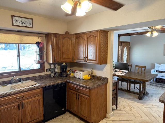 1637 Skeels Ave, Eau Claire, WI 54701 - kitchen with dark countertops, ceiling fan, brown cabinets, a sink, and dishwasher