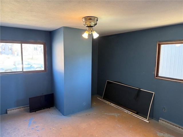 1637 Skeels Ave, Eau Claire, WI 54701 - empty room featuring a ceiling fan and a baseboard radiator