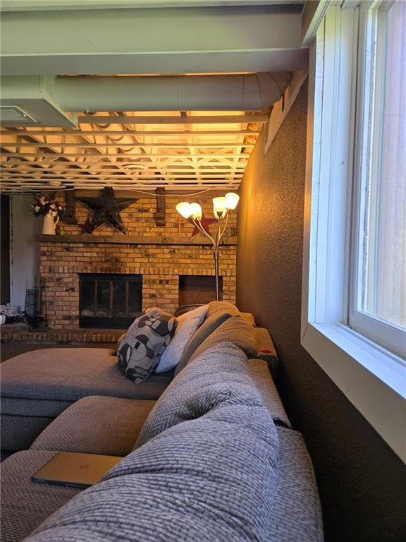 1637 Skeels Ave, Eau Claire, WI 54701 - interior space featuring a textured wall and a fireplace
