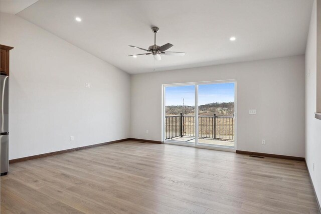 2465 Russell Ct, Reedsburg, WI 53959 - spare room featuring light wood-style floors, baseboards, visible vents, and ceiling fan
