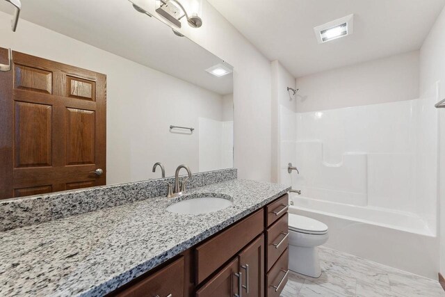 2465 Russell Ct, Reedsburg, WI 53959 - full bath featuring bathing tub / shower combination, vanity, visible vents, toilet, and marble finish floor