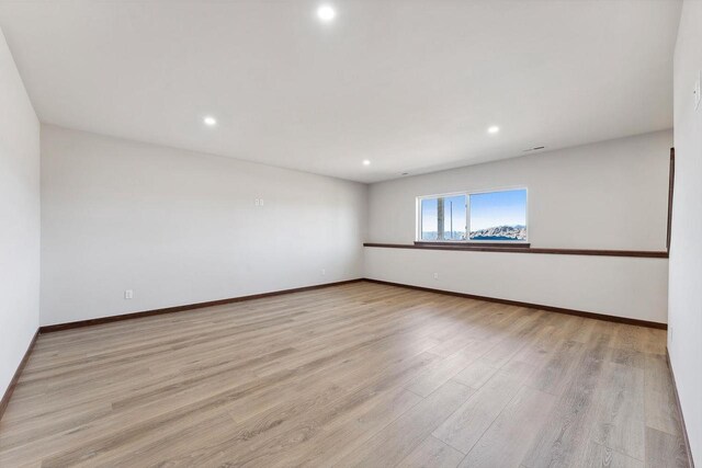 2465 Russell Ct, Reedsburg, WI 53959 - empty room with recessed lighting, light wood finished floors, and baseboards