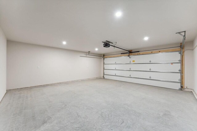 2465 Russell Ct, Reedsburg, WI 53959 - garage featuring a garage door opener