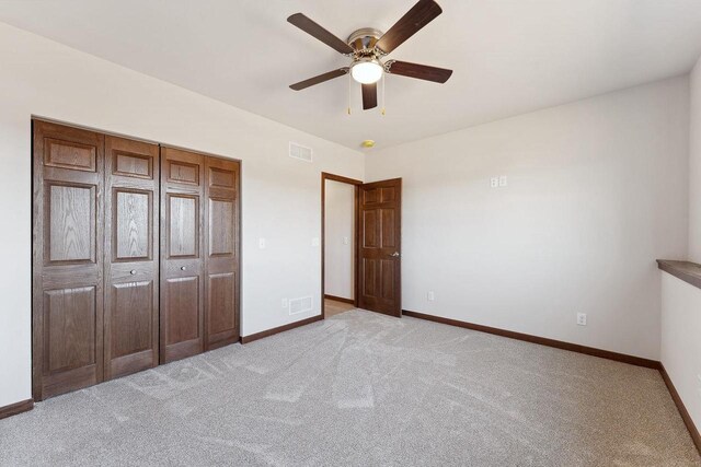 2465 Russell Ct, Reedsburg, WI 53959 - unfurnished bedroom with visible vents, baseboards, and light colored carpet