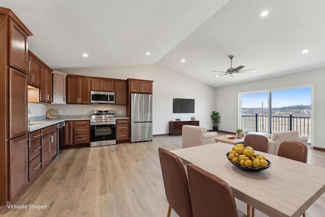 2465 Russell Ct, Reedsburg, WI 53959 - kitchen with light wood-style flooring, light countertops, ceiling fan, stainless steel appliances, and a sink