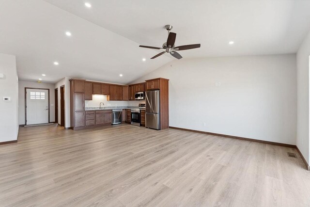 2465 Russell Ct, Reedsburg, WI 53959 - unfurnished living room featuring light wood-style floors, a sink, a ceiling fan, and visible vents