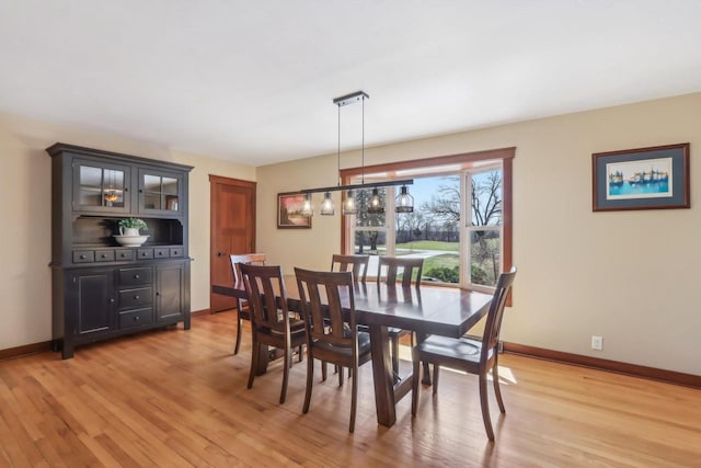 N3759 Airport Rd, Cambridge, WI 53523 - dining area with light wood-type flooring and baseboards