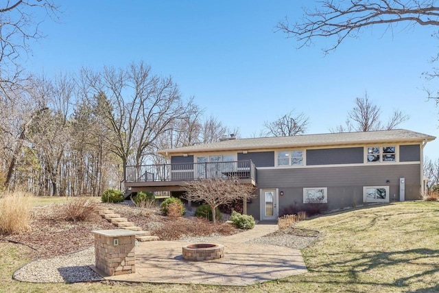 N3759 Airport Rd, Cambridge, WI 53523 - view of front facade featuring a wooden deck, a front yard, a fire pit, and stairs