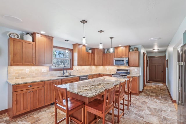N3759 Airport Rd, Cambridge, WI 53523 - kitchen with baseboards, light stone countertops, decorative backsplash, stainless steel appliances, and a sink