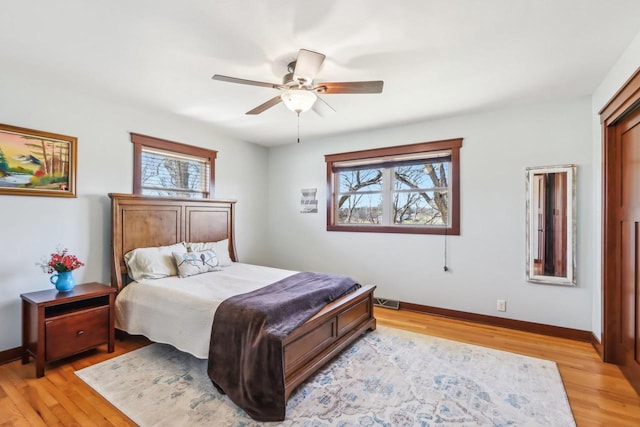 N3759 Airport Rd, Cambridge, WI 53523 - bedroom featuring light wood finished floors, multiple windows, and baseboards