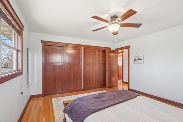 N3759 Airport Rd, Cambridge, WI 53523 - bedroom with a closet, light wood-style floors, baseboards, and a ceiling fan