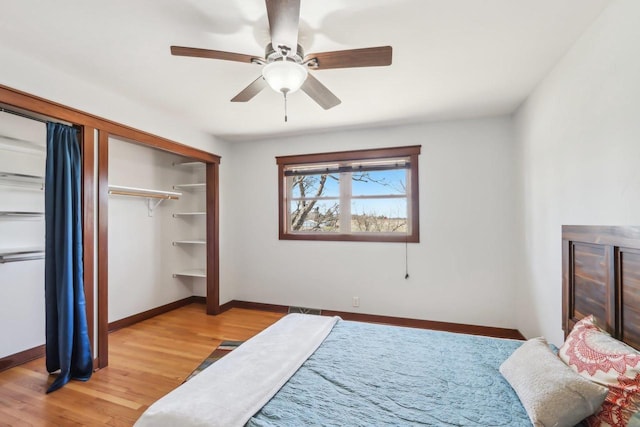 N3759 Airport Rd, Cambridge, WI 53523 - bedroom with a closet, light wood finished floors, baseboards, and ceiling fan