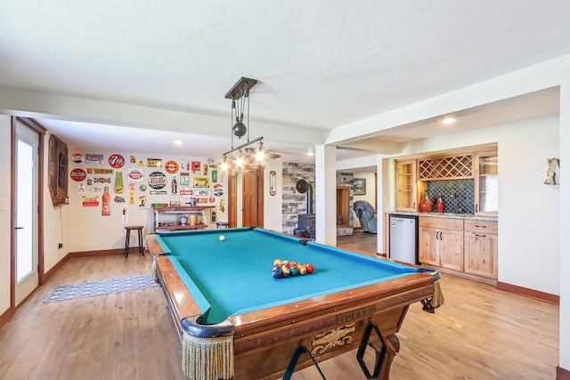 N3759 Airport Rd, Cambridge, WI 53523 - recreation room with pool table, light wood-style floors, a textured ceiling, and bar
