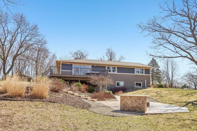 N3759 Airport Rd, Cambridge, WI 53523 - back of property with a wooden deck and a lawn