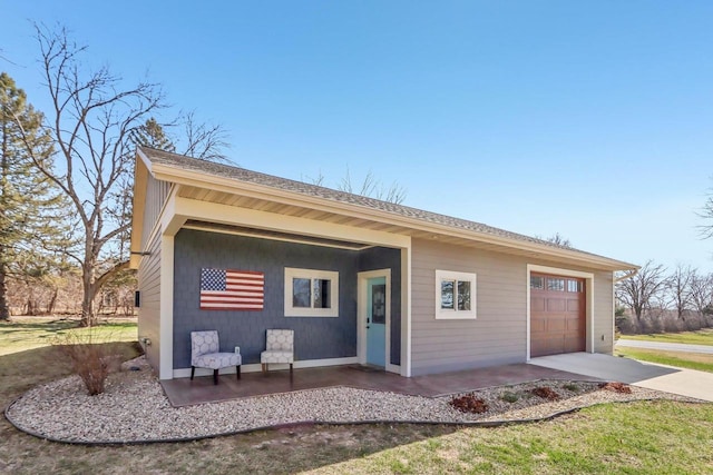 N3759 Airport Rd, Cambridge, WI 53523 - rear view of property featuring a garage and driveway