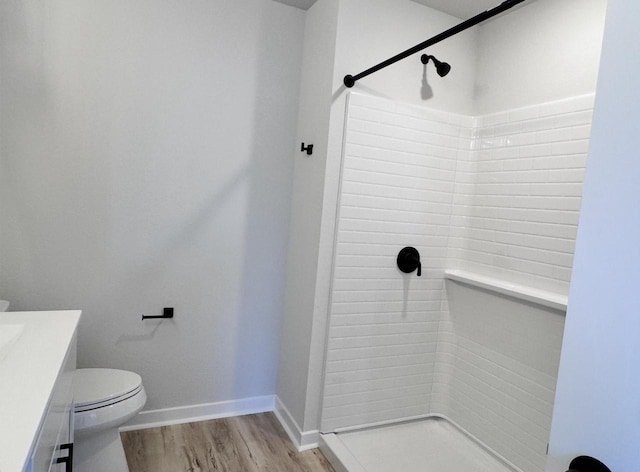 333 Kiddle Ln, Union Grove, WI 53182 - full bathroom with vanity, toilet, a shower, and wood finished floors