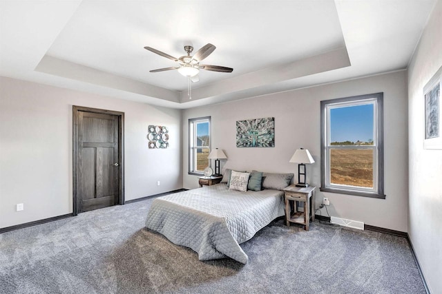 665 Kroll Rd, Pulaski, WI 54162 - bedroom featuring a raised ceiling, carpet flooring, baseboards, and ceiling fan