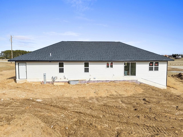 665 Kroll Rd, Pulaski, WI 54162 - rear view of property featuring a shingled roof and central AC unit