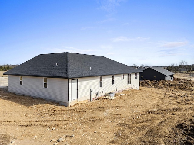 665 Kroll Rd, Pulaski, WI 54162 - rear view of property with a shingled roof