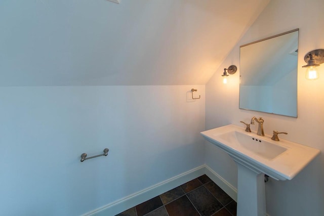 6579 Maple Tree Rd, Crescent, WI 54501 - bathroom featuring baseboards and vaulted ceiling