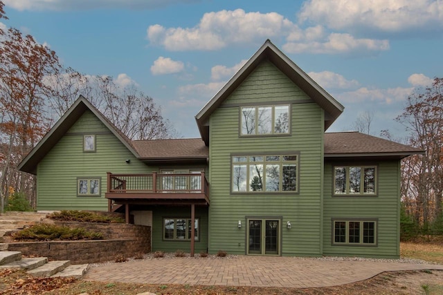 6579 Maple Tree Rd, Crescent, WI 54501 - rear view of house with roof with shingles, a patio area, a deck, and french doors
