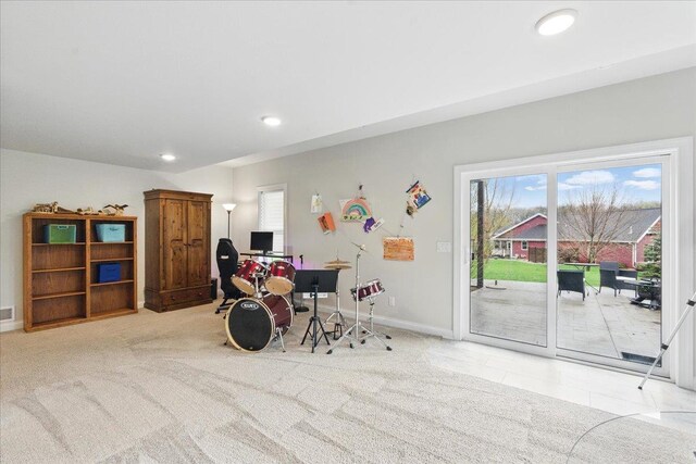 interior space featuring recessed lighting, baseboards, plenty of natural light, and carpet