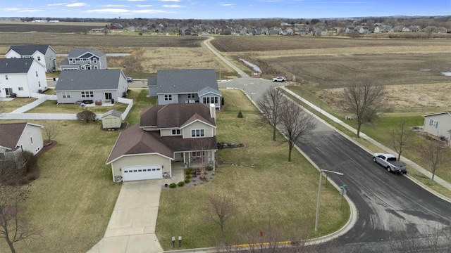 birds eye view of property with a residential view