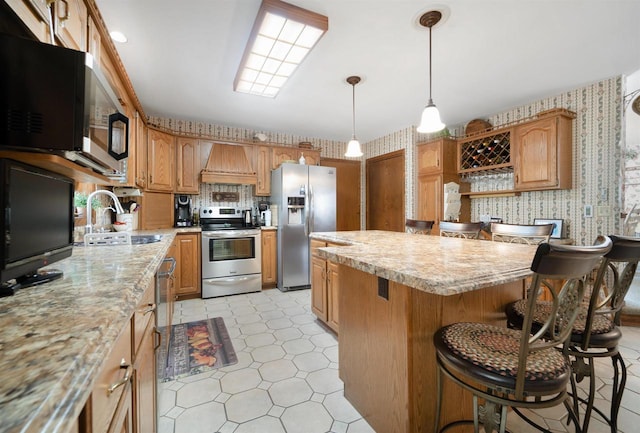 N5120 Summit Ct, Fond Du Lac, WI 54937 - kitchen featuring custom range hood, a sink, wallpapered walls, and appliances with stainless steel finishes