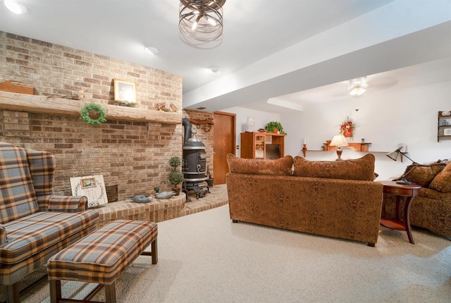 N5120 Summit Ct, Fond Du Lac, WI 54937 - living area with brick wall, a wood stove, and carpet floors