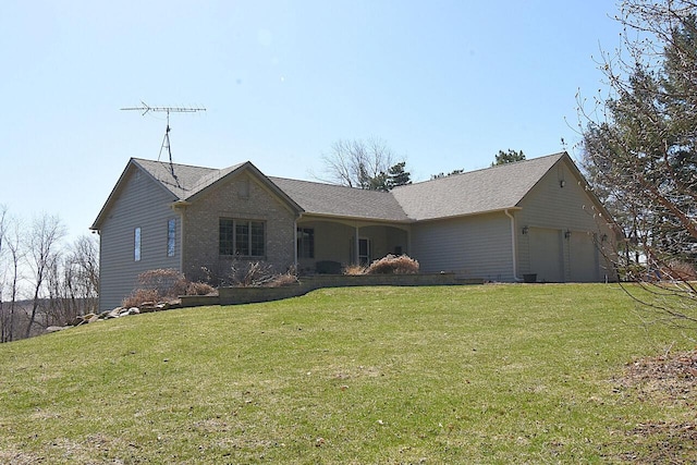 ranch-style home with a front yard and an attached garage