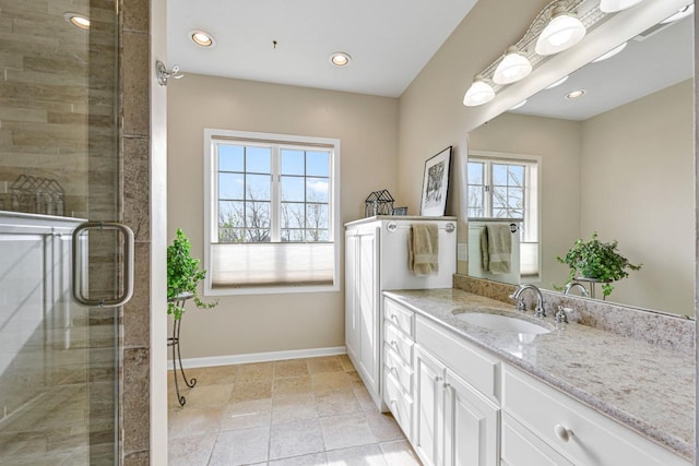 full bath with recessed lighting, tiled shower, vanity, visible vents, and baseboards