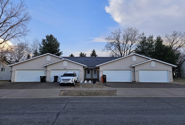 5709 Gables Dr Unit 0, Eau Claire, WI 54701 - view of front of house with a garage and aphalt driveway