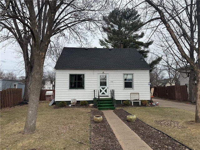 1708 5th St, Menomonie, WI 54751 - view of front of home featuring fence and roof with shingles