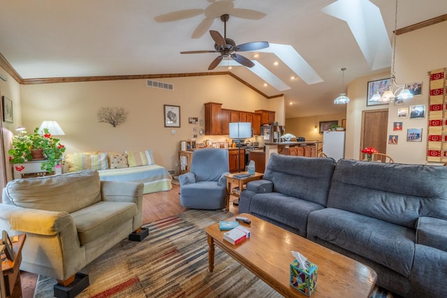 421 Nature Haven Blvd Unit 15, Kewaskum, WI 53040 - living room with visible vents, wood finished floors, a ceiling fan, and ornamental molding