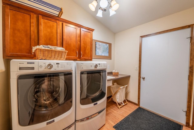 421 Nature Haven Blvd Unit 15, Kewaskum, WI 53040 - clothes washing area with cabinet space, washer and clothes dryer, and light wood finished floors