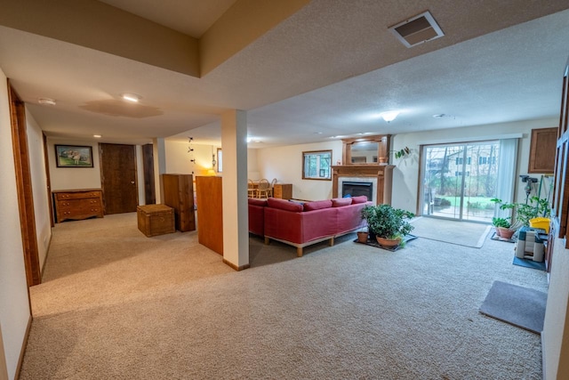 421 Nature Haven Blvd Unit 15, Kewaskum, WI 53040 - carpeted living area featuring visible vents and a fireplace
