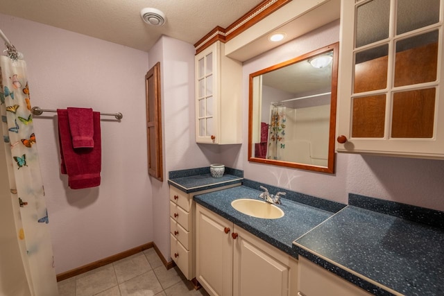 421 Nature Haven Blvd Unit 15, Kewaskum, WI 53040 - full bath with vanity, visible vents, baseboards, tile patterned flooring, and a shower with shower curtain