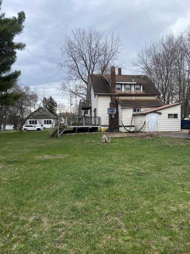 view of yard featuring an outbuilding and a deck